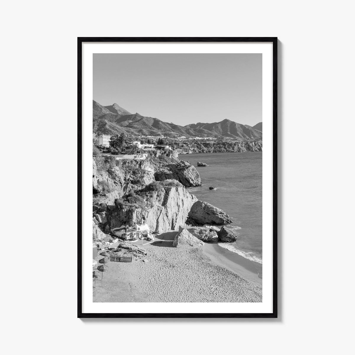 Nerja black & white photo poster of Spain – vertical wall art, unframed print shown in interior mockup