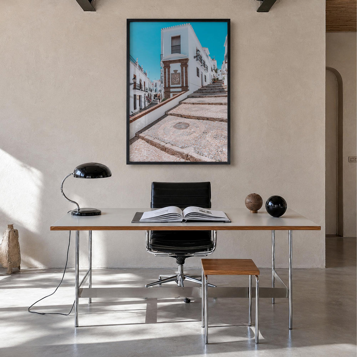 Nerja colorful photo poster of Spain – vertical wall art in black wood frame, hanging on wall