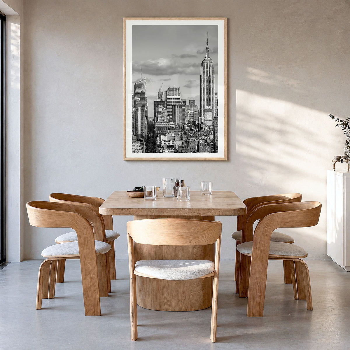 New York City Photo No 3 Poster in a natural wood frame, hanging in a dining room, white border
