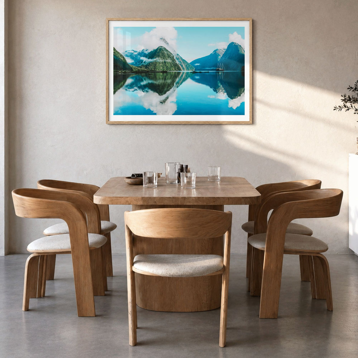 New Zealand Photo Poster in a natural wood frame, hanging in a dining room, white border