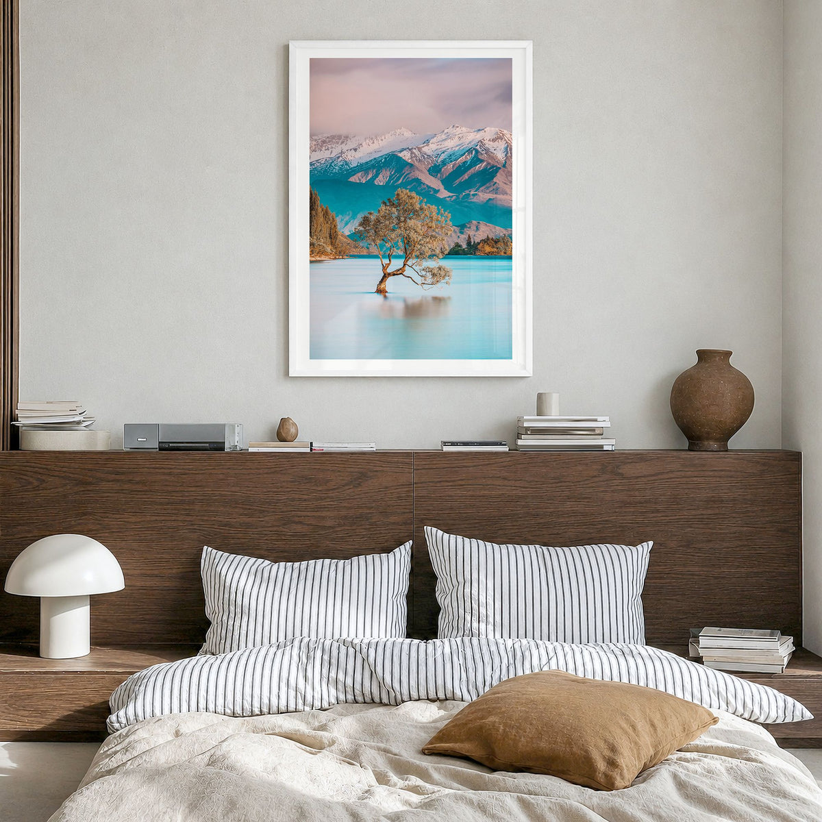 New Zealand Photo Poster in a white wood frame, hanging in a bedroom, white border