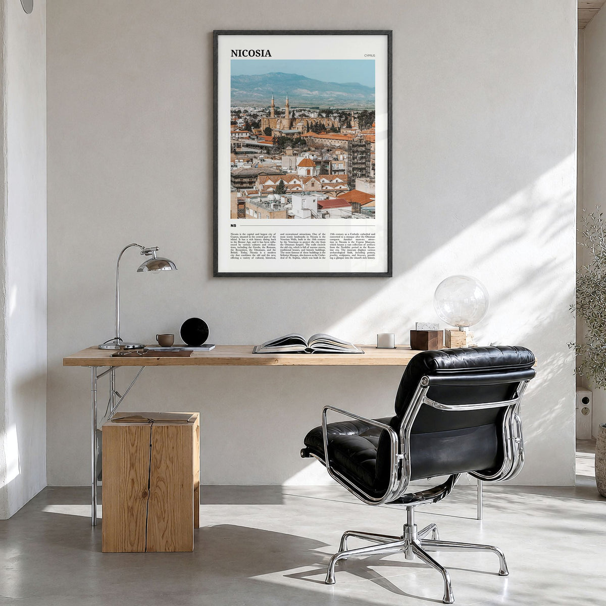 Nicosia Travel Poster in a black wood frame, hanging in a bright home office