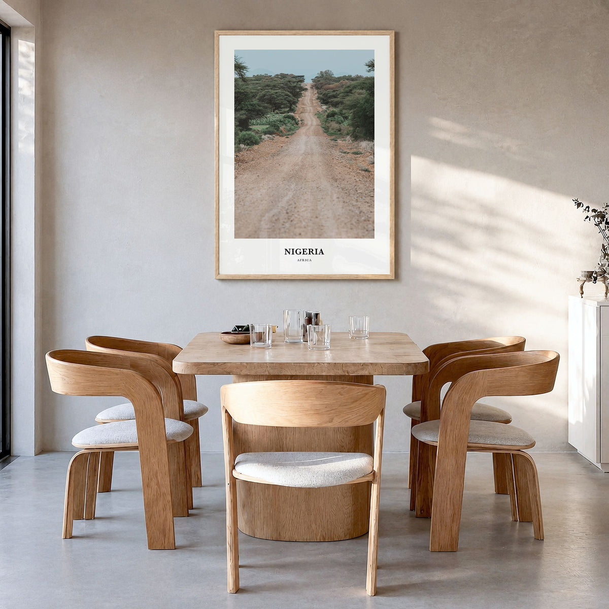Nigeria Classic Poster in a natural wood frame, hanging in a dining room