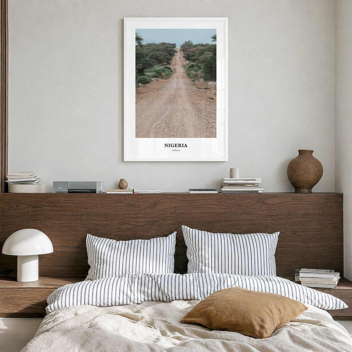 Nigeria Classic Poster in a white wood frame, hanging in a bedroom