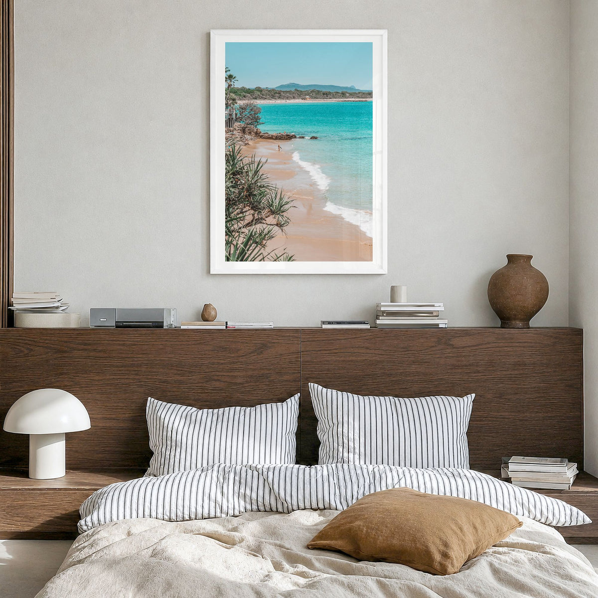 Noosa Heads Photo Poster in a white wood frame, hanging in a bedroom, white border