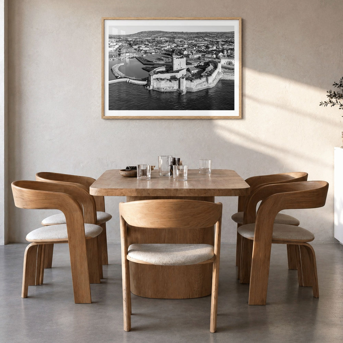 Norman Photo Poster in a natural wood frame, hanging in a dining room, white border