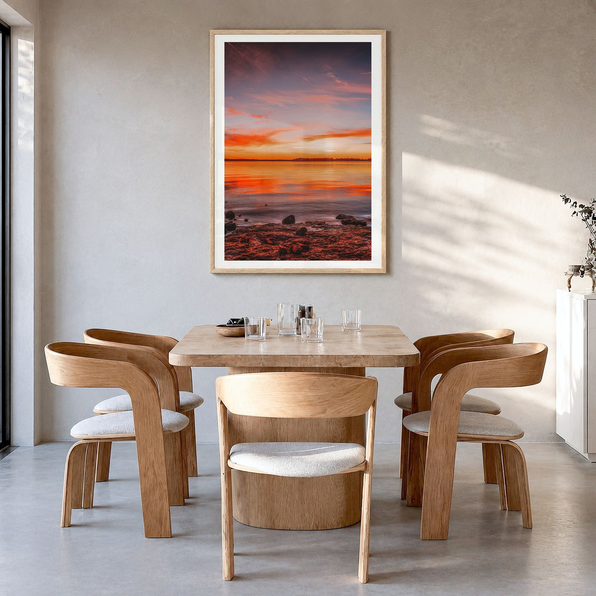 Norman Photo No 1 Poster in a natural wood frame, hanging in a dining room, white border