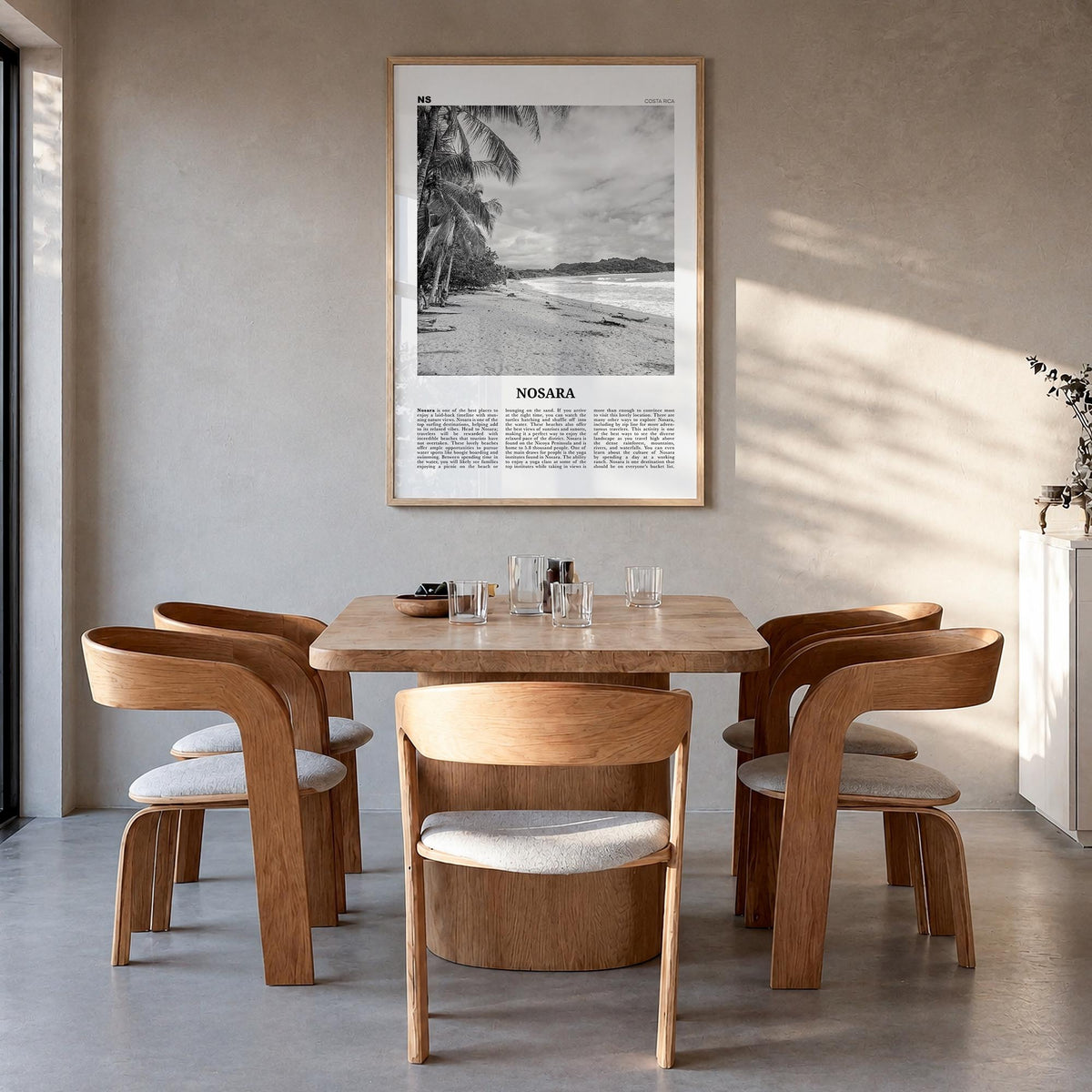 Nosara black & white newspaper poster of Costa Rica – vertical wall art in natural wood frame, hanging on wall
