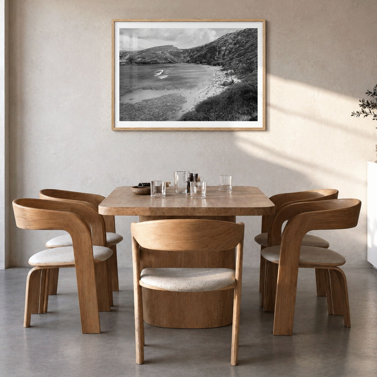 O‘ahu Photo Poster in a natural wood frame, hanging in a dining room, white border