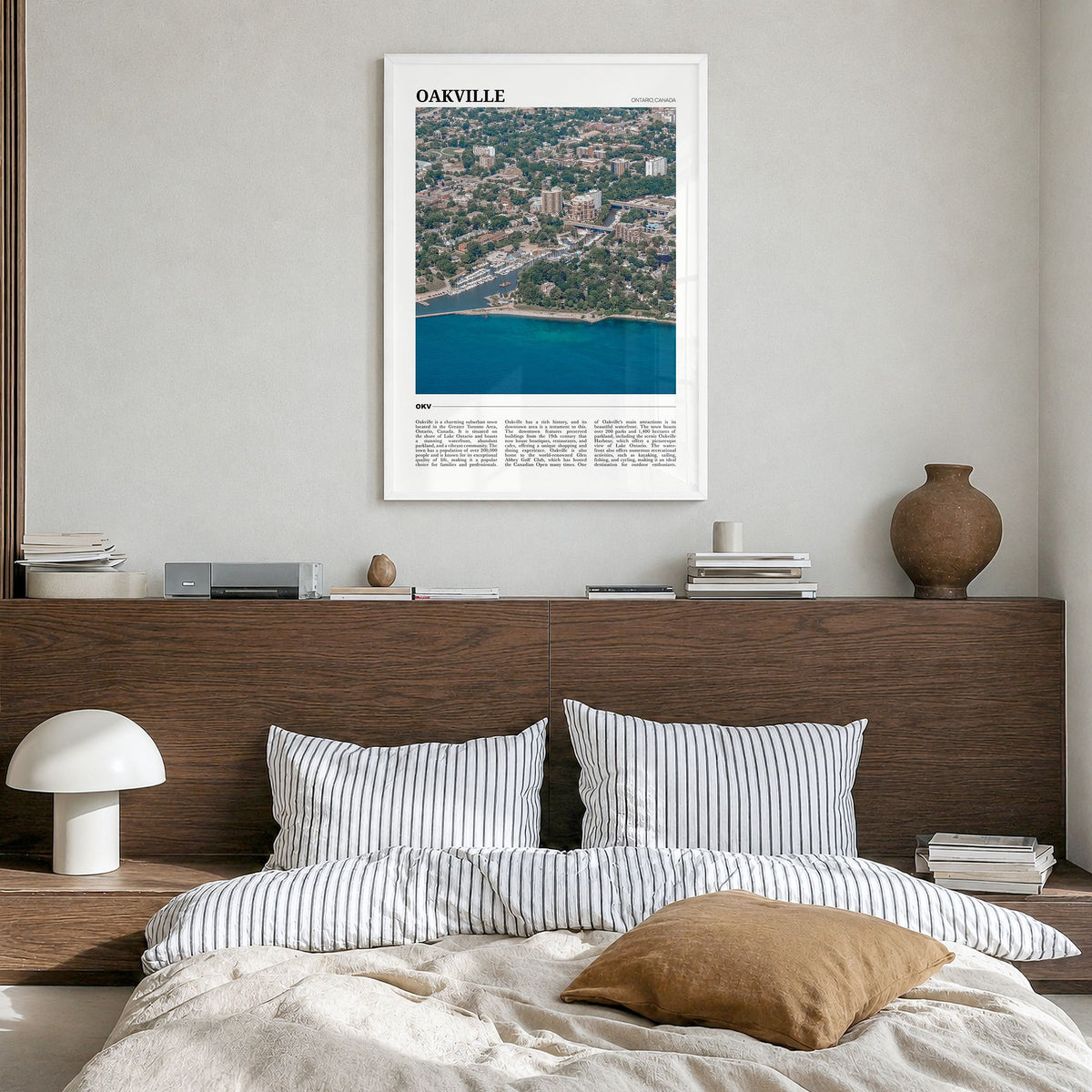 Oakville Travel Poster in a white wood frame, hanging in a bedroom