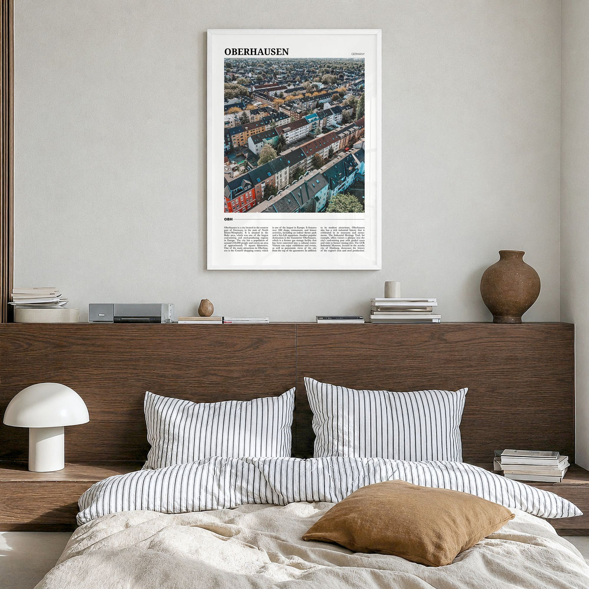 Oberhausen Travel Poster in a white wood frame, hanging in a bedroom