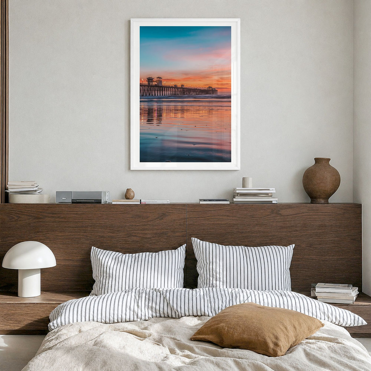 Oceanside Photo No 4 Poster in a white wood frame, hanging in a bedroom, white border