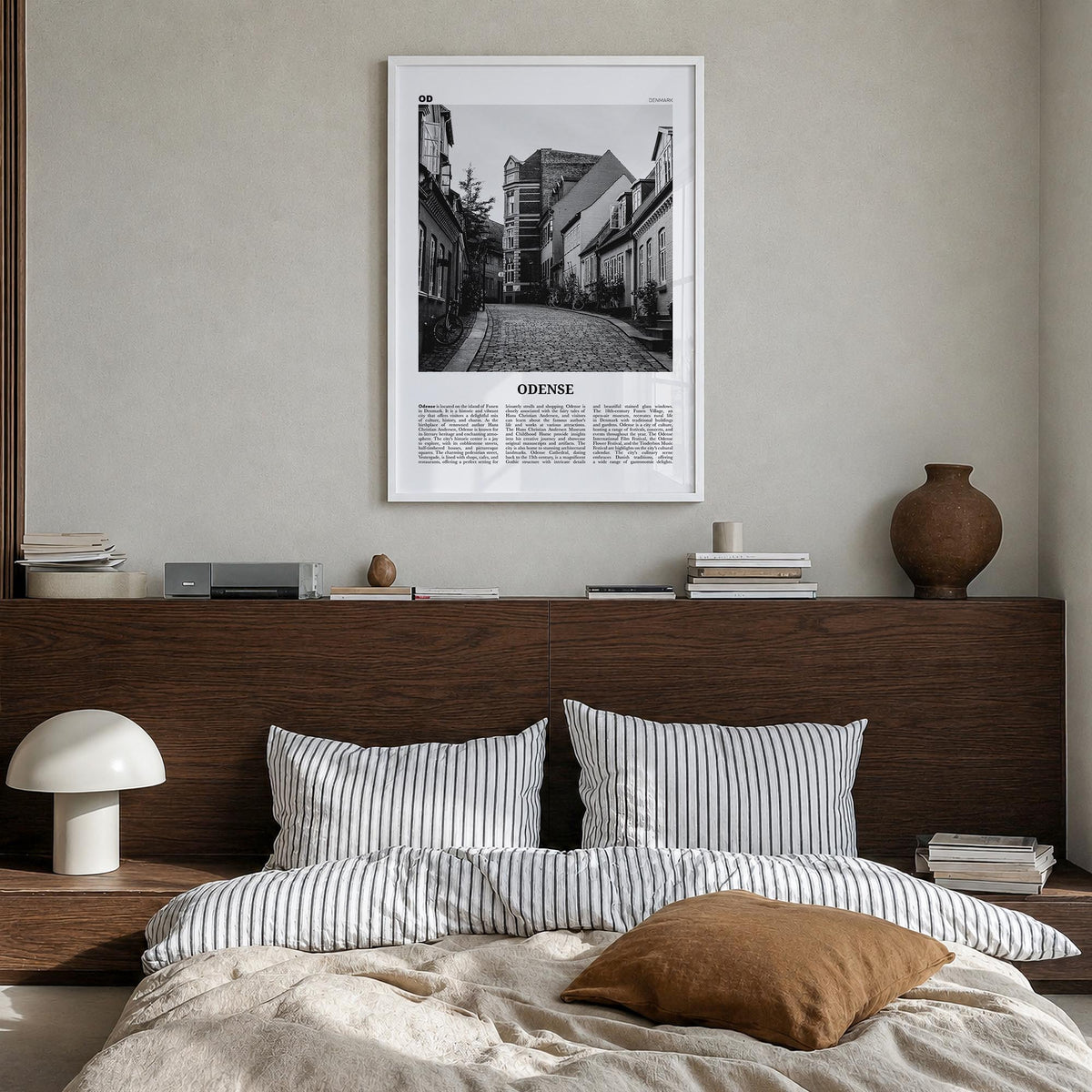 Odense black & white newspaper poster of Denmark – vertical wall art in white wood frame, hanging on wall