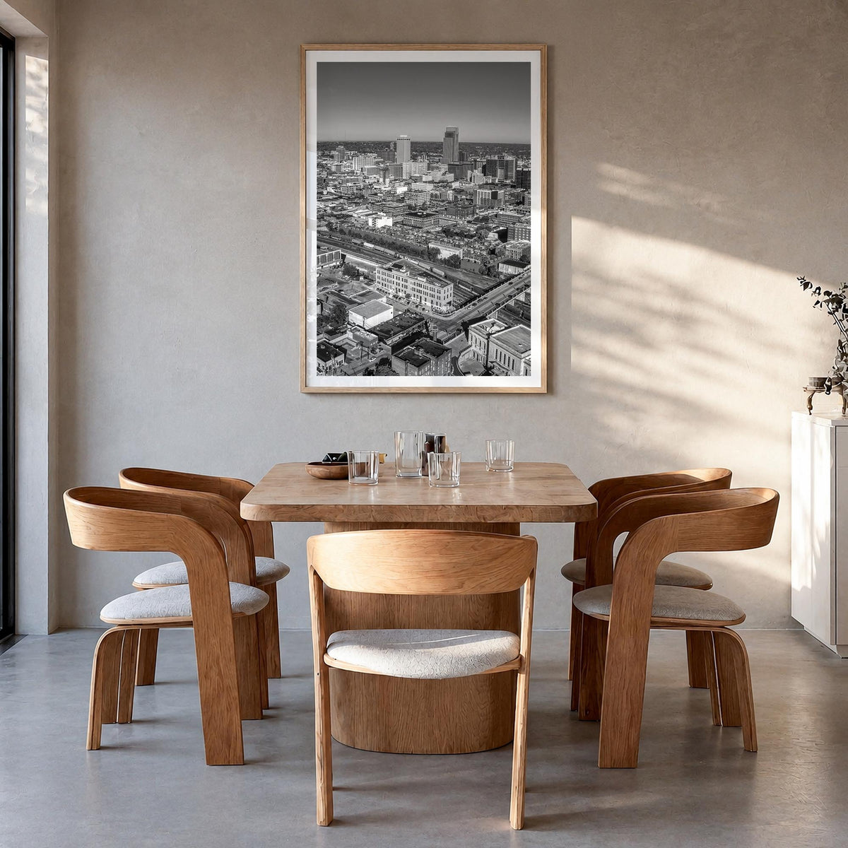 Omaha black & white photo poster of Nebraska, USA – vertical wall art in natural wood frame with white border, hanging on wal