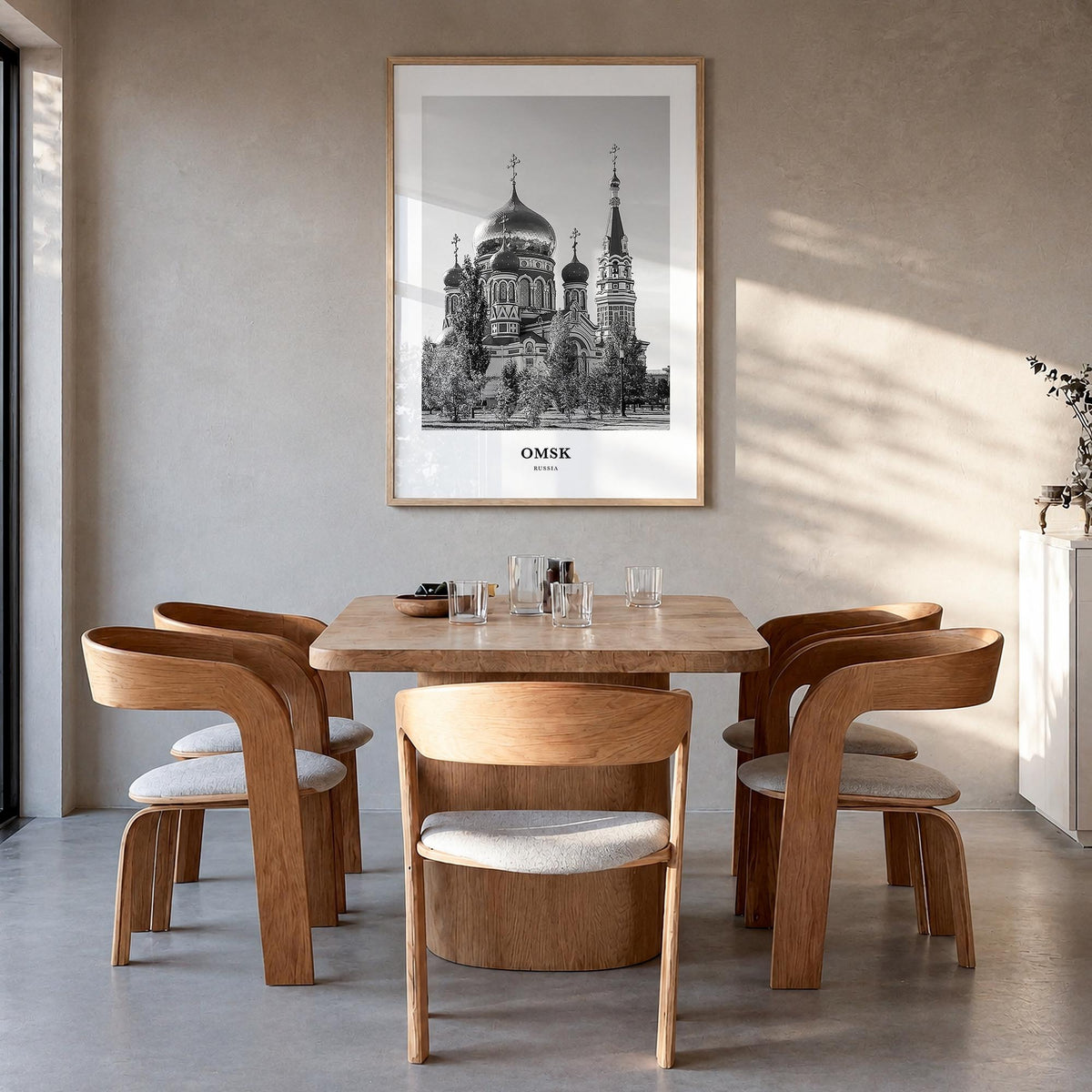 Omsk black & white classic poster of Russia – vertical wall art in natural wood frame, hanging on wall