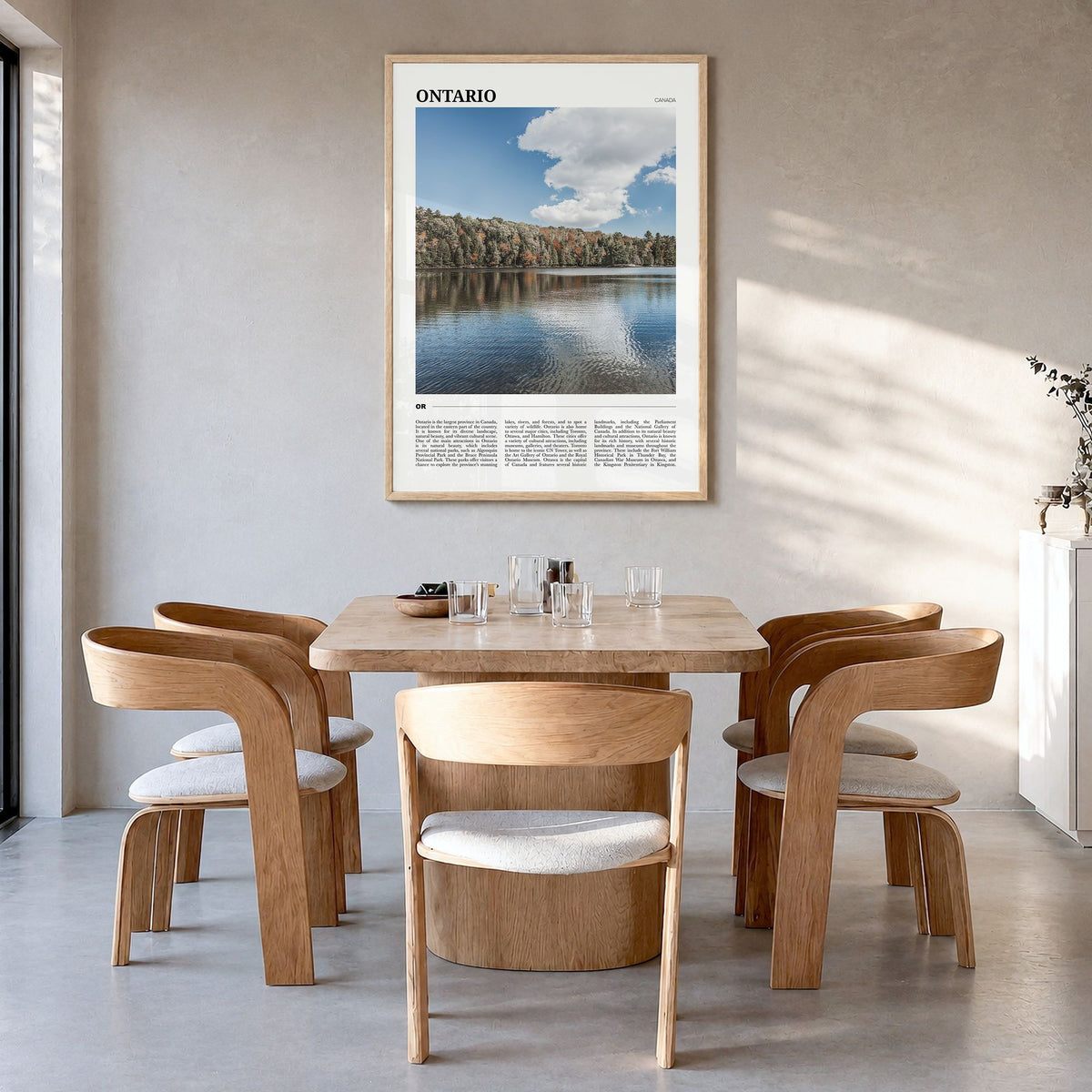 Ontario Travel Poster in a natural wood frame, hanging in a dining room