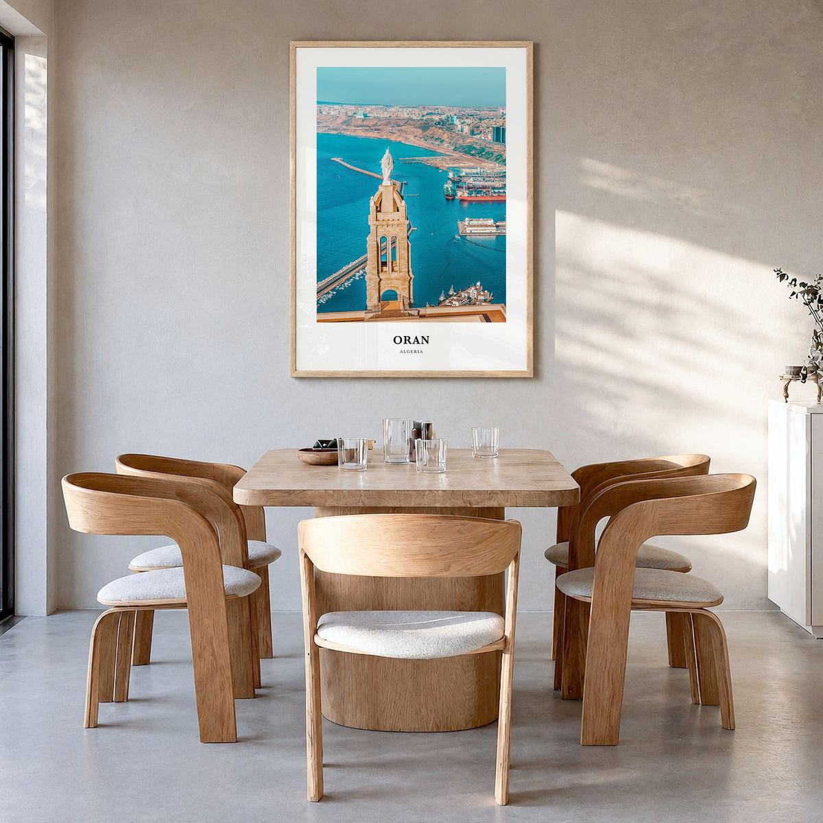 Oran Classic Poster in a natural wood frame, hanging in a dining room