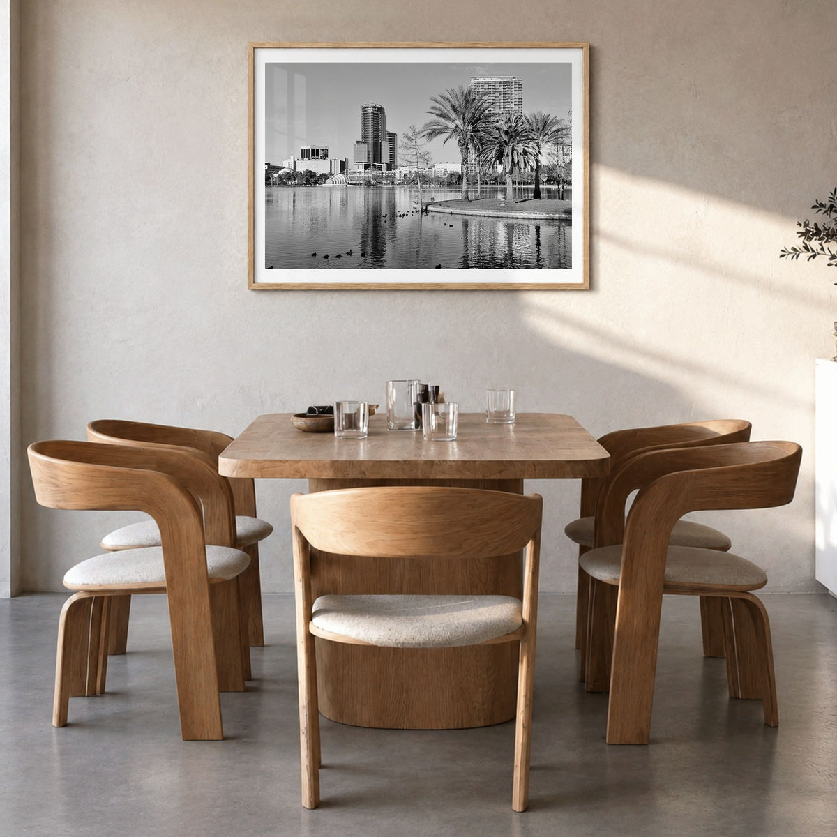 Orlando Photo Poster in a natural wood frame, hanging in a dining room, white border