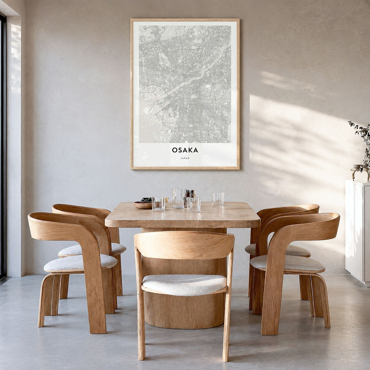 Osaka Map Poster in a natural wood frame, hanging in a dining room
