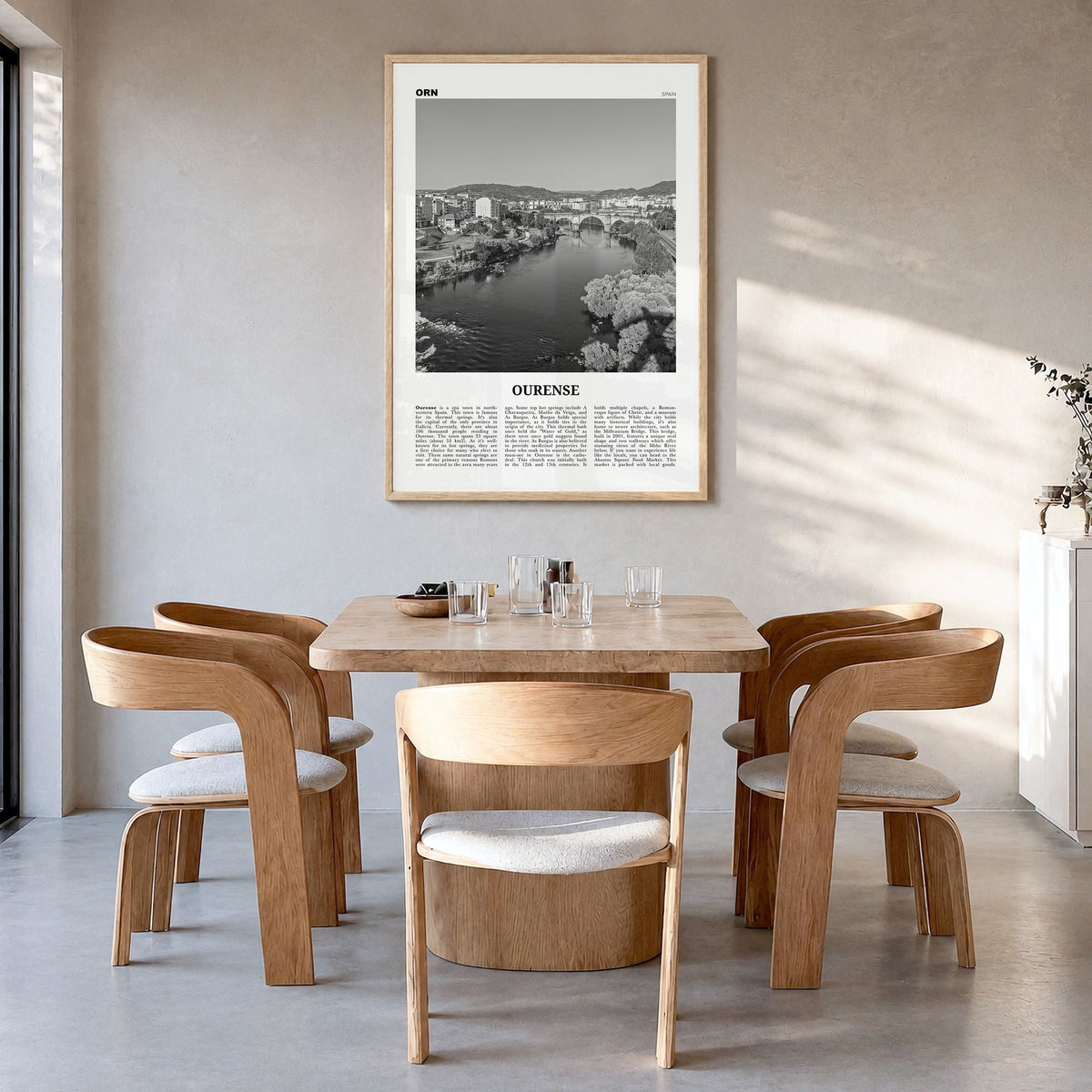 Ourense Newspaper Poster in a natural wood frame, hanging in a dining room