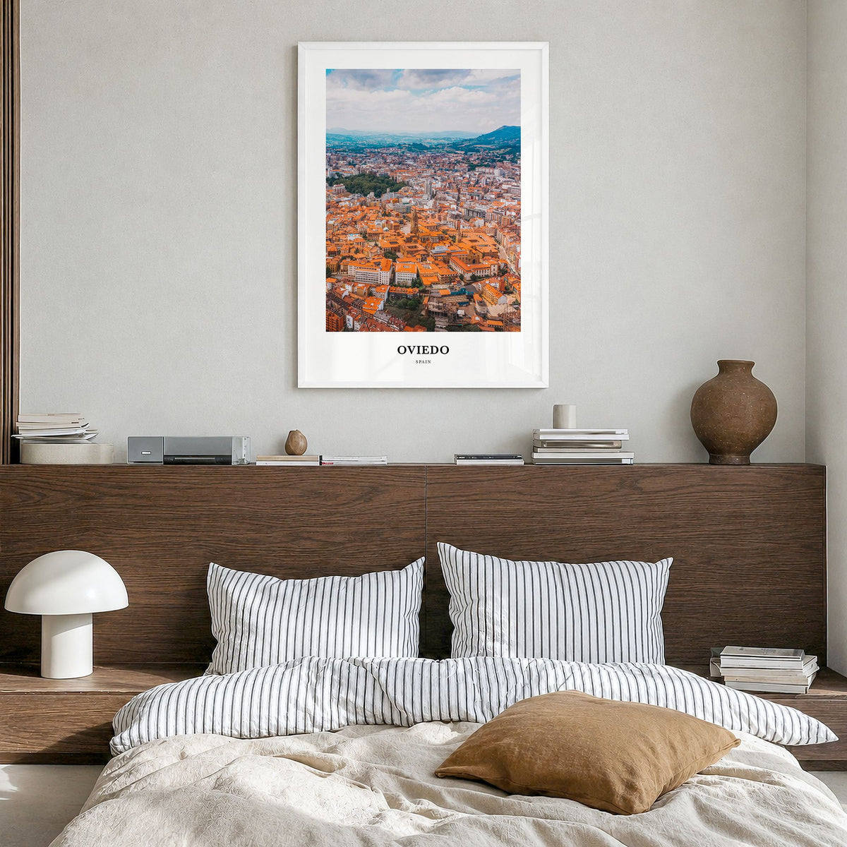 Oviedo Classic Poster in a white wood frame, hanging in a bedroom