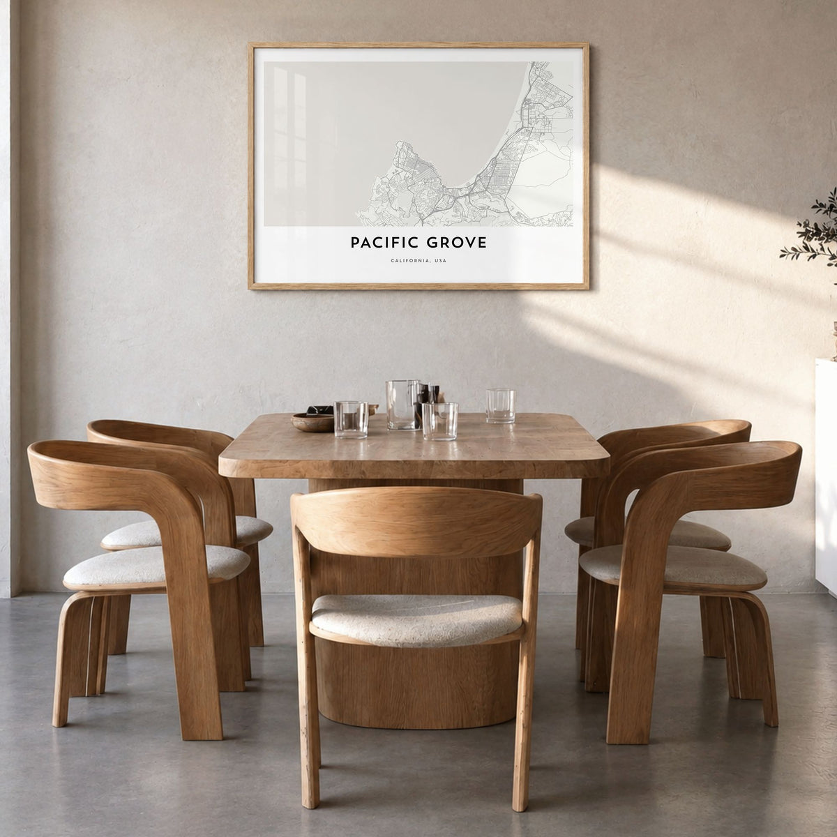 Pacific Grove Map Poster in a natural wood frame, hanging in a dining room