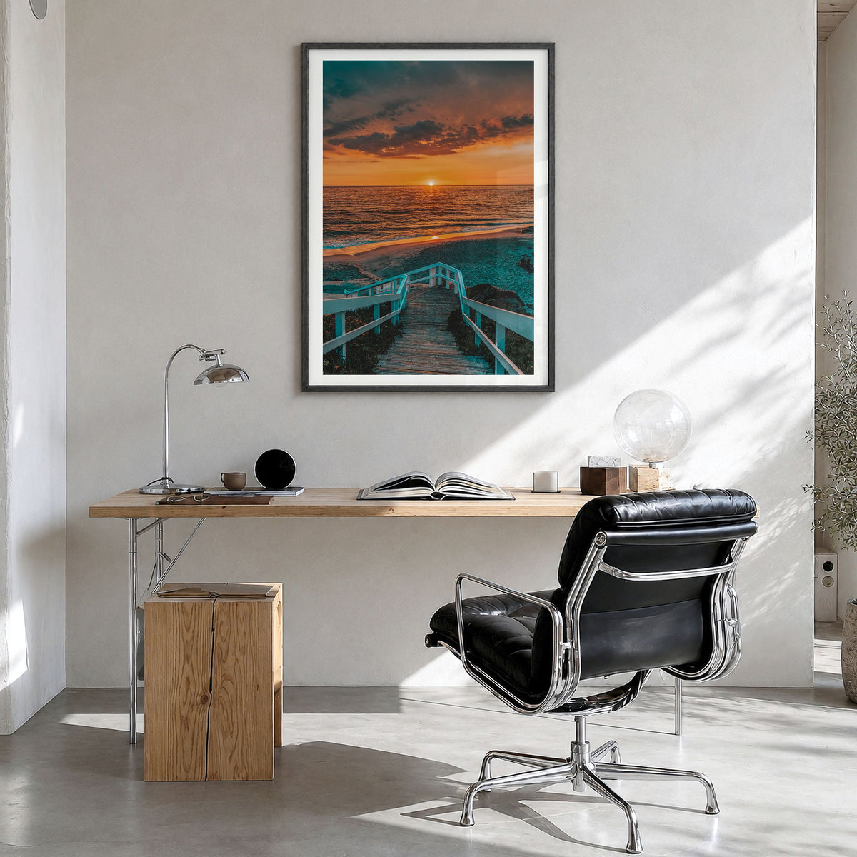 Pacific Ocean Photo Poster in a black wood frame, hanging in a bright home office, white border