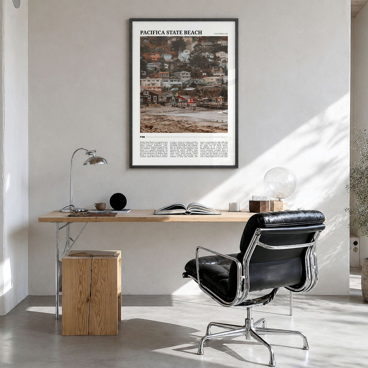 Pacifica State Beach Travel Poster in a black wood frame, hanging in a bright home office