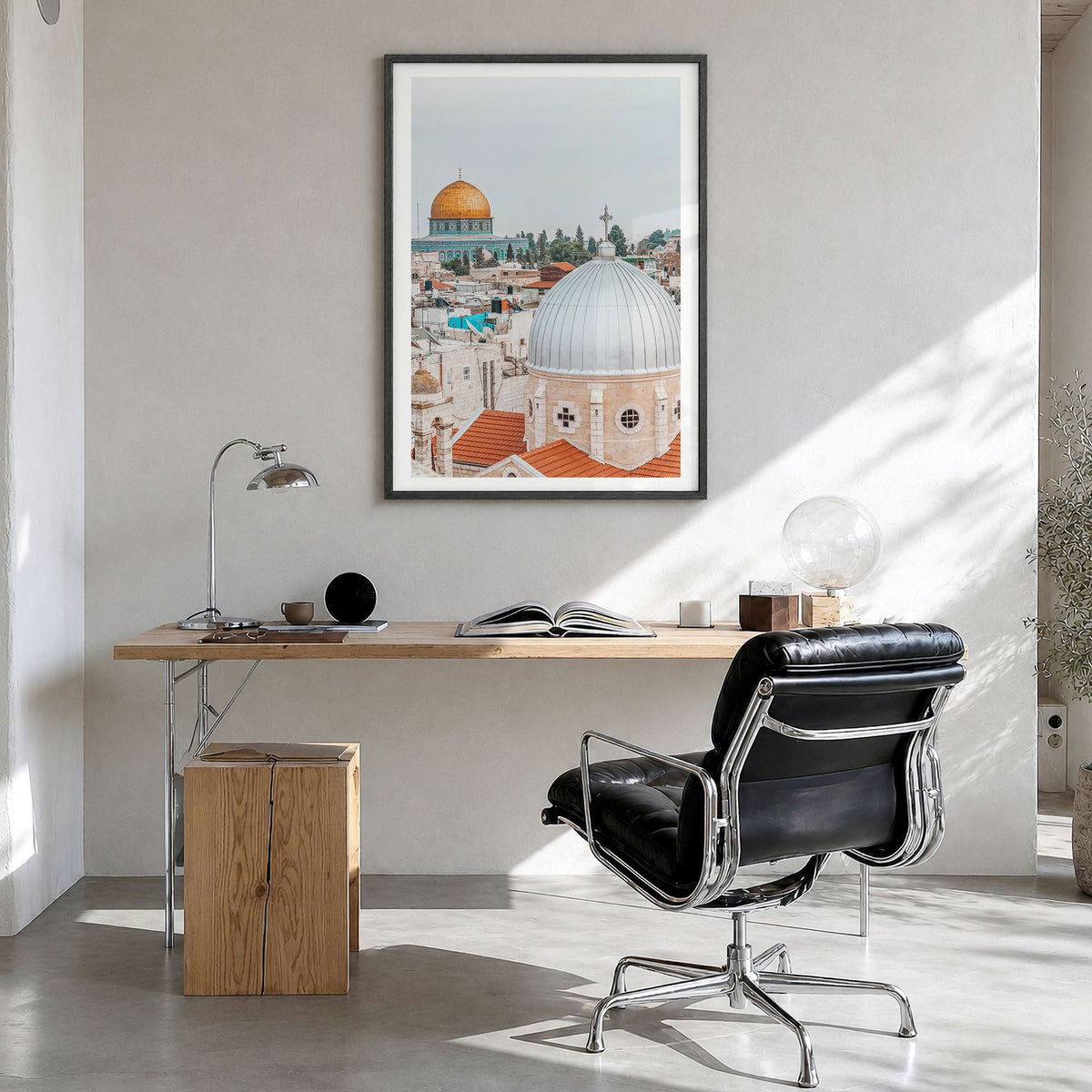 Palestine Photo Poster in a black wood frame, hanging in a bright home office, white border