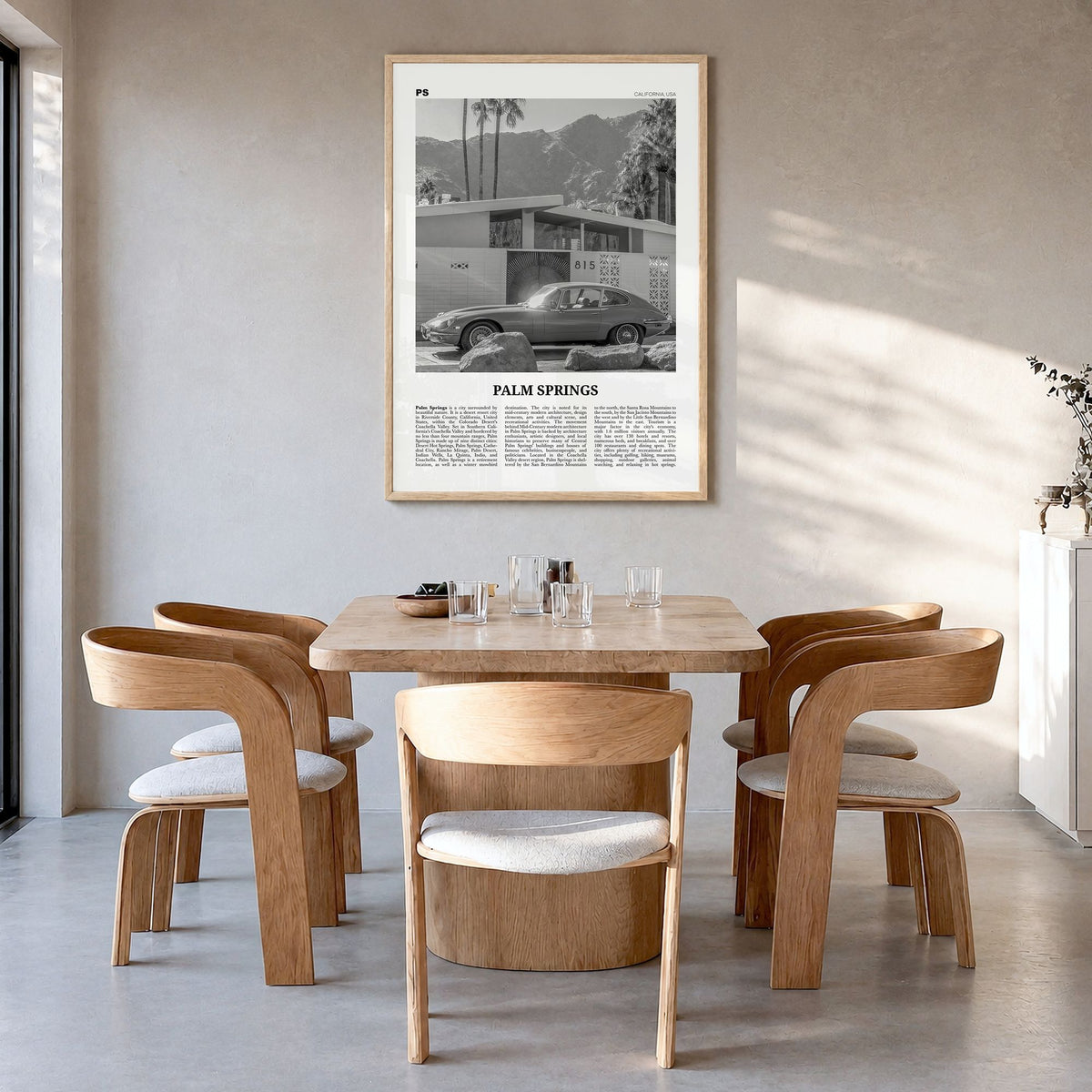 Palm Springs Newspaper No 2 Poster in a natural wood frame, hanging in a dining room