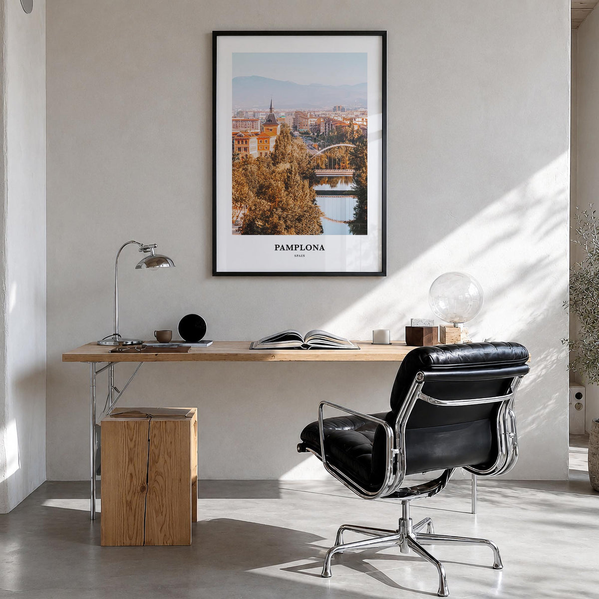 Pamplona colorful classic poster of Spain – vertical wall art in black wood frame, hanging on wall