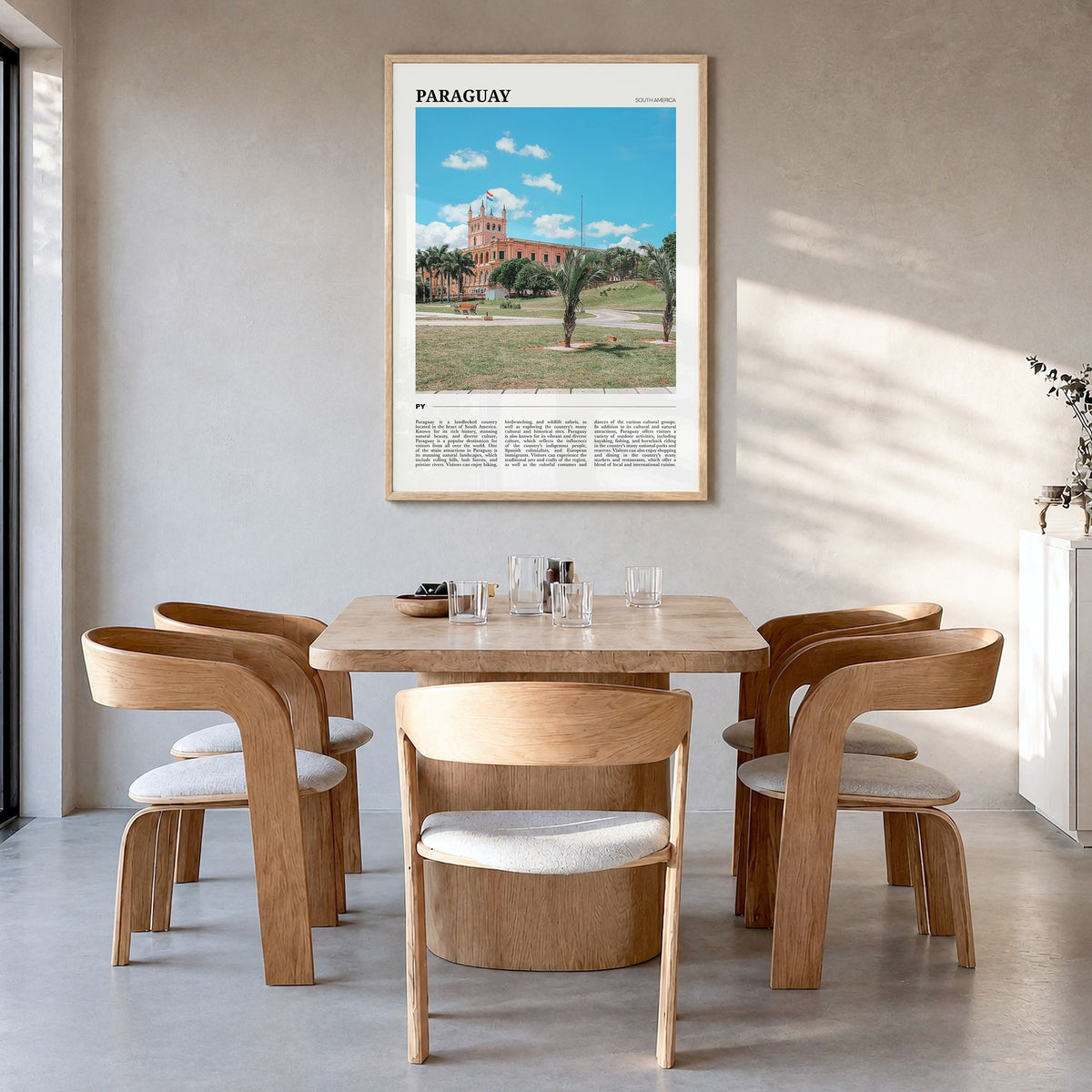 Paraguay Travel Poster in a natural wood frame, hanging in a dining room