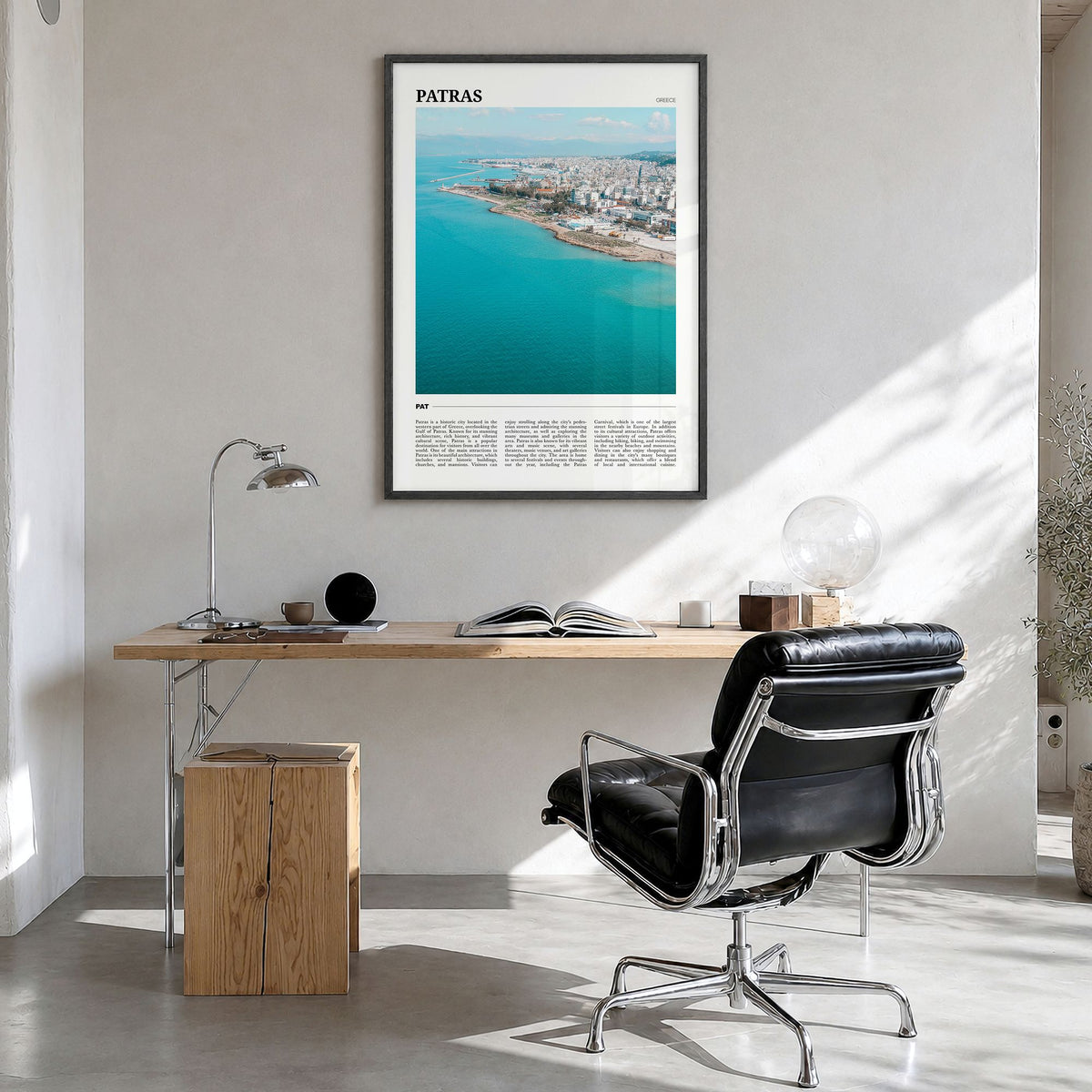 Patras Travel Poster in a black wood frame, hanging in a bright home office