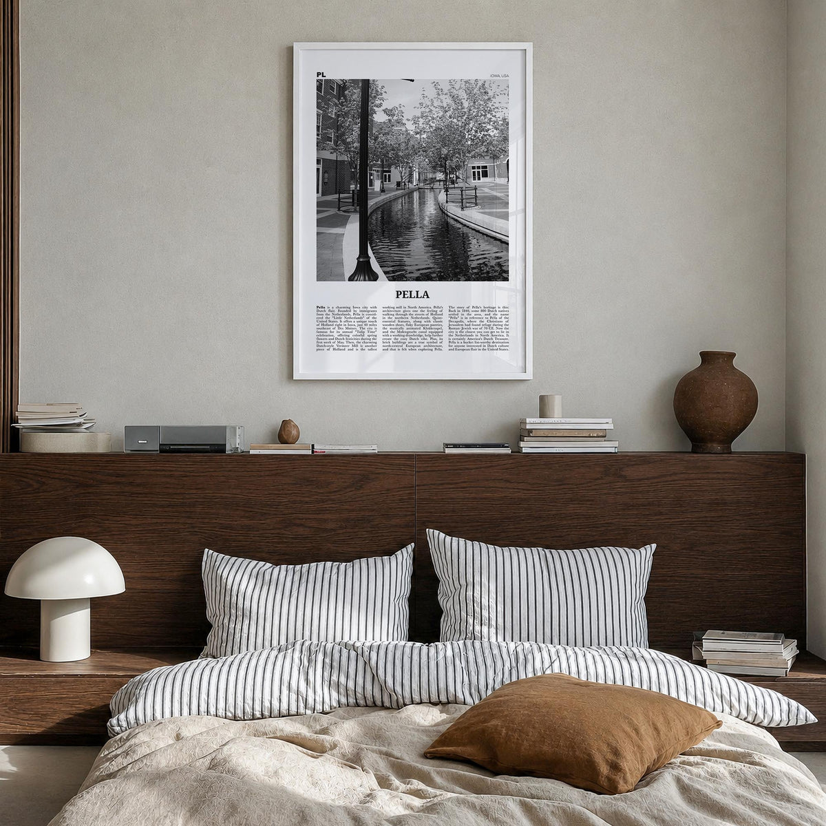 Pella, Iowa black & white newspaper poster of Iowa, USA – vertical wall art in white wood frame, hanging on wall