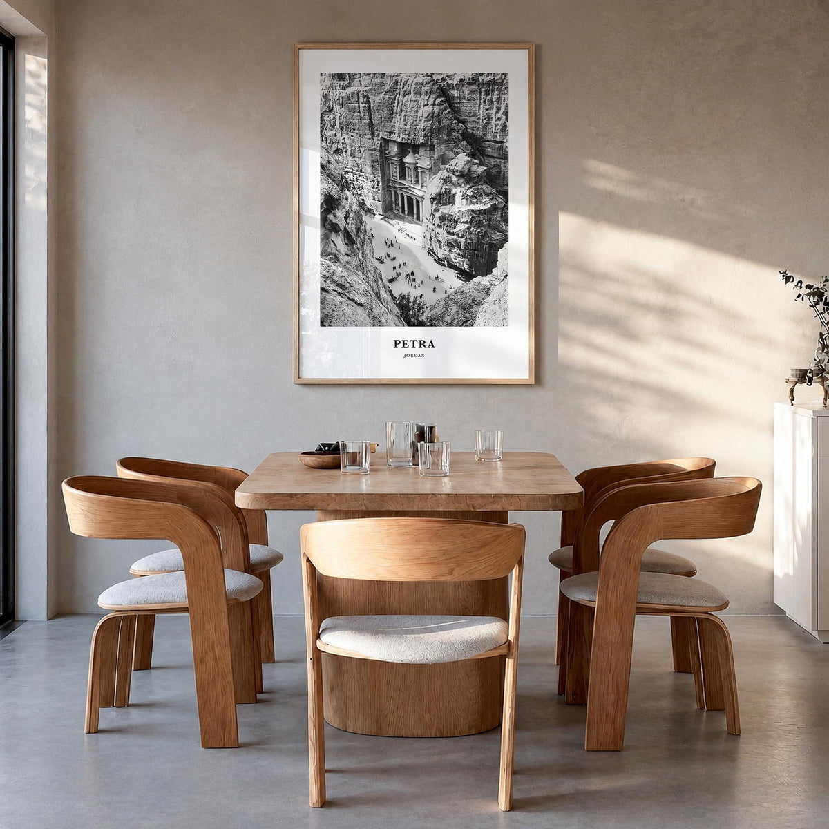 Petra black & white classic poster of Jordan – vertical wall art in natural wood frame, hanging on wall