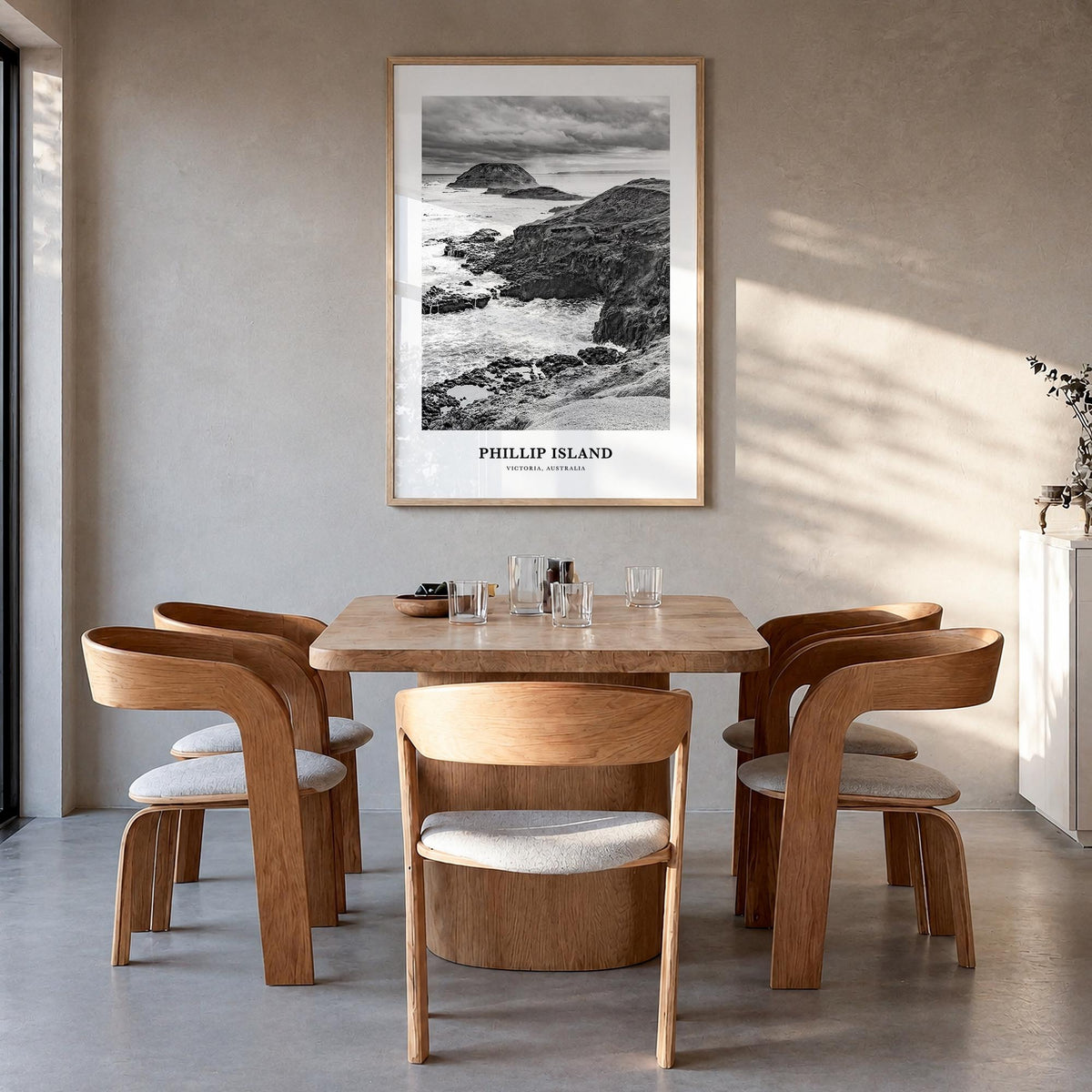 Phillip Island black & white classic poster of Australia – vertical wall art in natural wood frame, hanging on wall