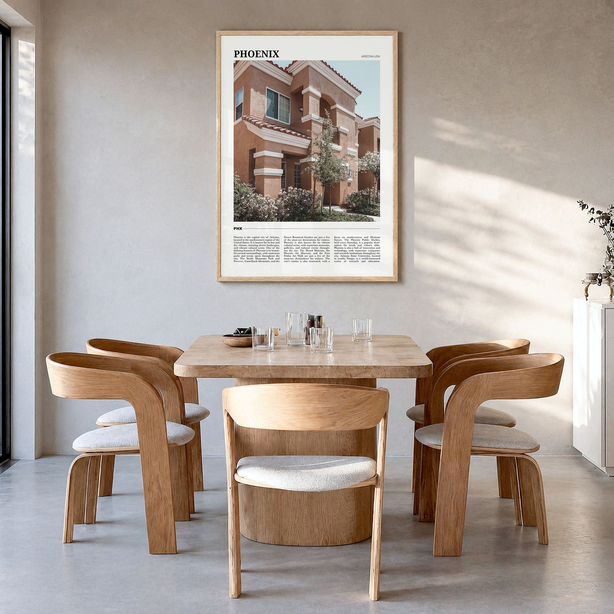 Phoenix Travel No 1 Poster in a natural wood frame, hanging in a dining room