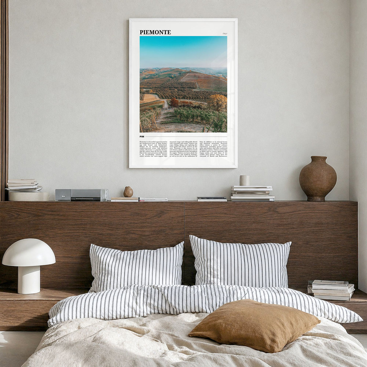 Piemonte Travel Poster in a white wood frame, hanging in a bedroom