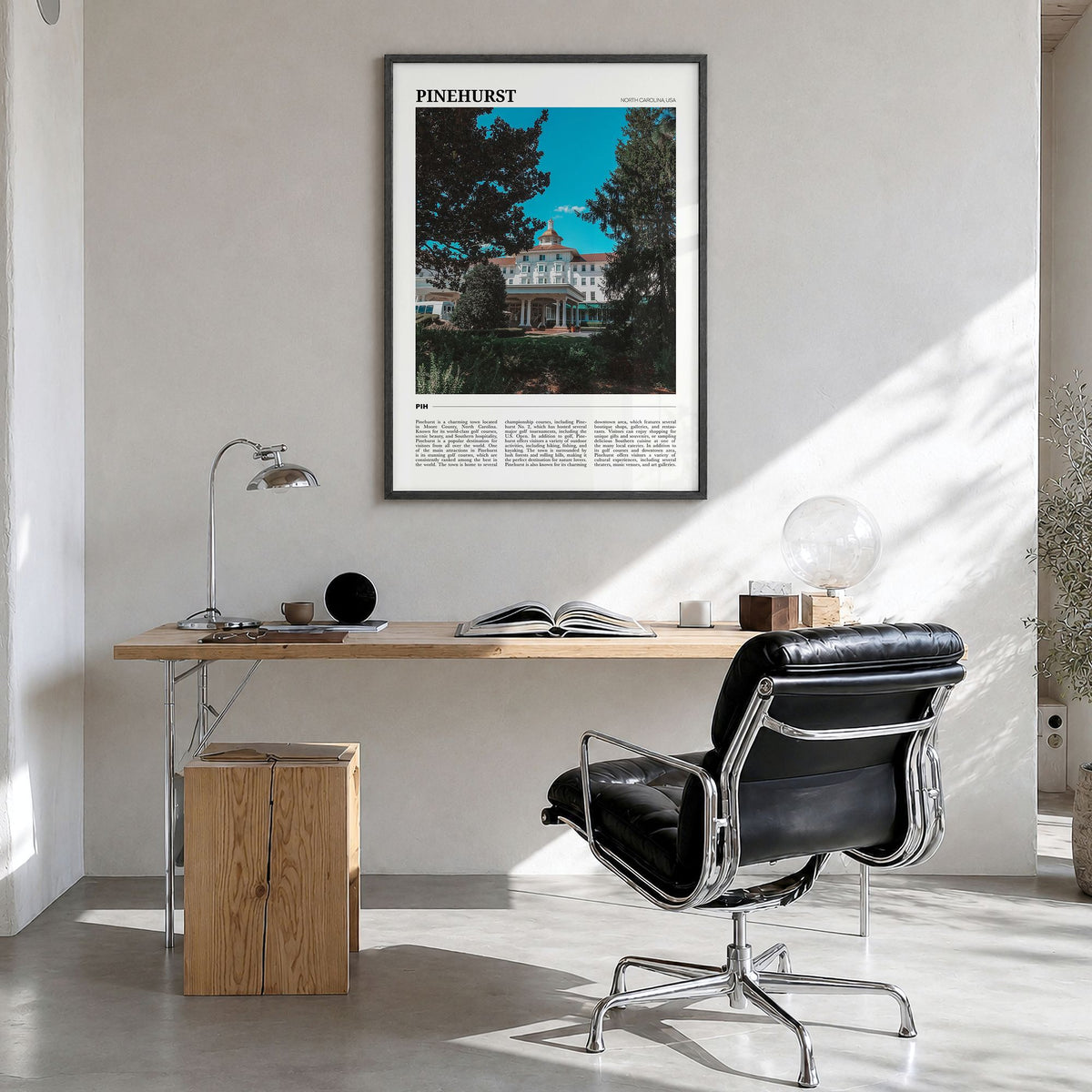 Pinehurst Travel Poster in a black wood frame, hanging in a bright home office