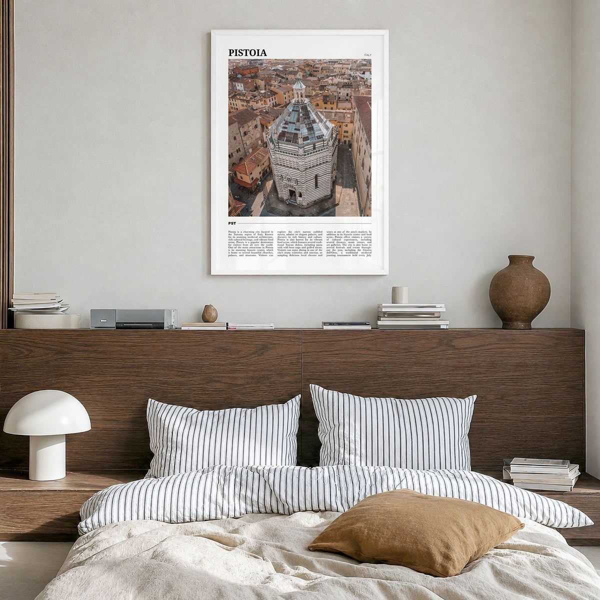 Pistoia Travel Poster in a white wood frame, hanging in a bedroom