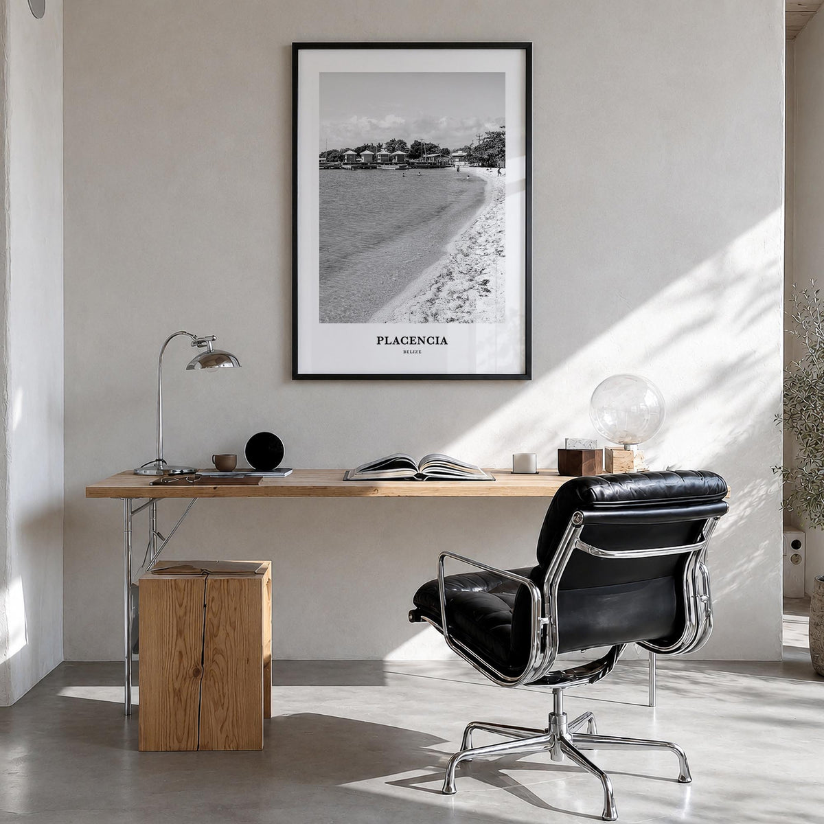 Placencia black & white classic poster of Belize – vertical wall art in black wood frame, hanging on wall