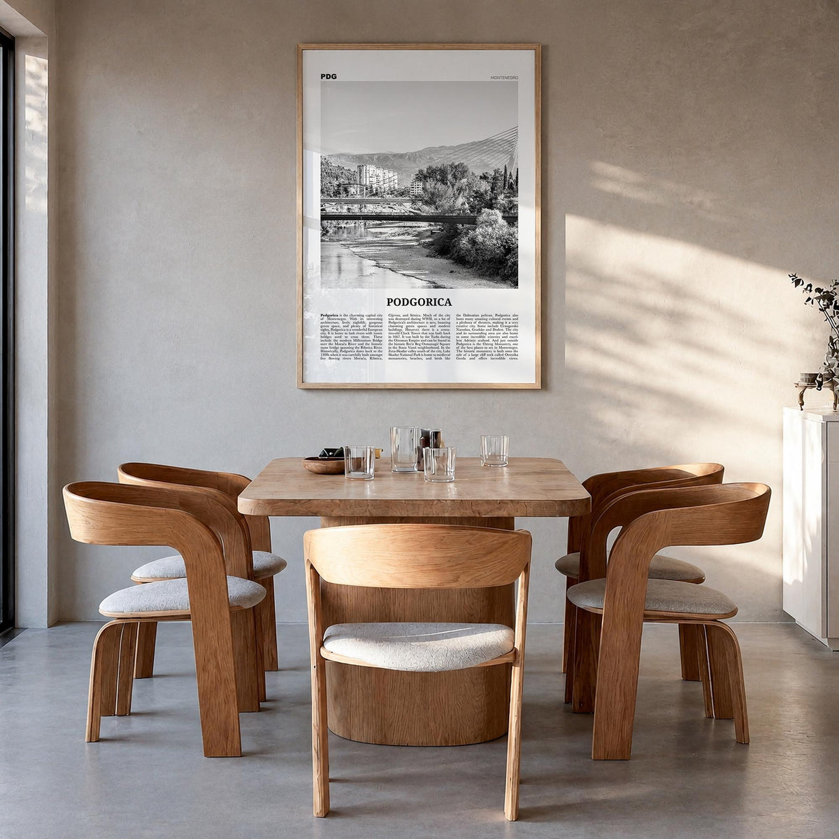 Podgorica black & white newspaper poster of Montenegro – vertical wall art in natural wood frame, hanging on wall