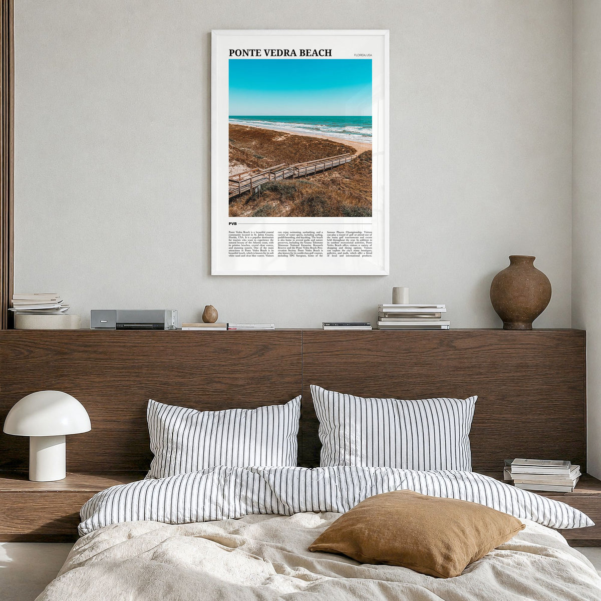 Ponte Vedra Beach Travel Poster in a white wood frame, hanging in a bedroom