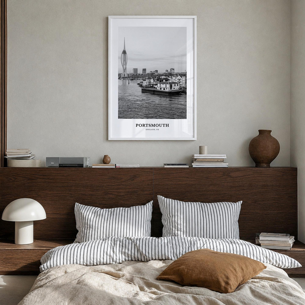 Portsmouth, England no. 1 black & white classic poster of England, UK – vertical wall art in white wood frame, hanging on wal
