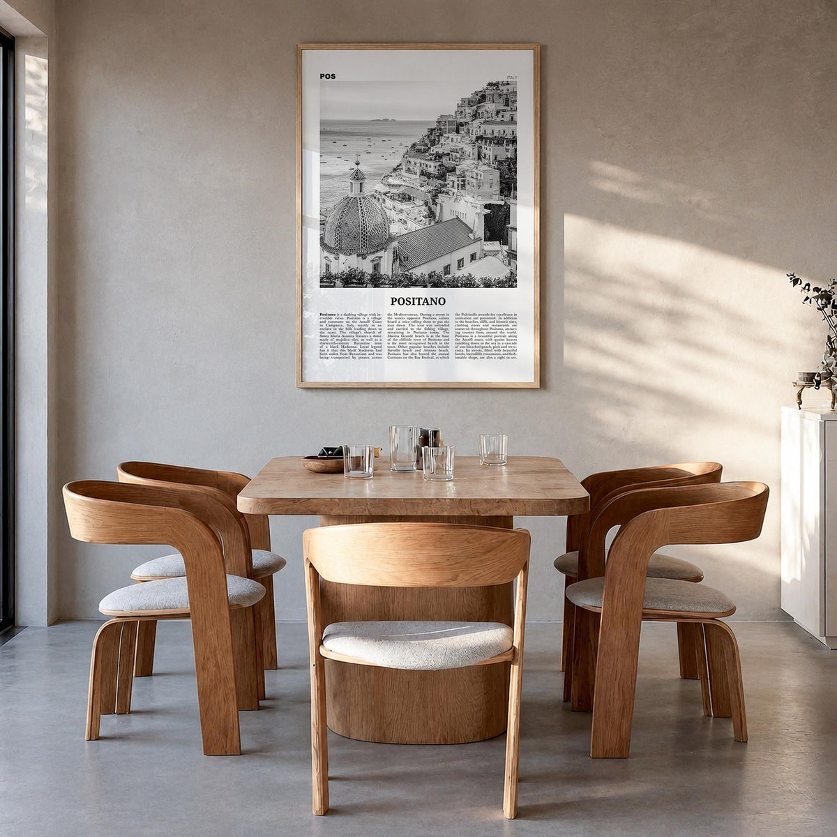 Positano no. 1 black & white newspaper poster of Italy – vertical wall art in natural wood frame, hanging on wall