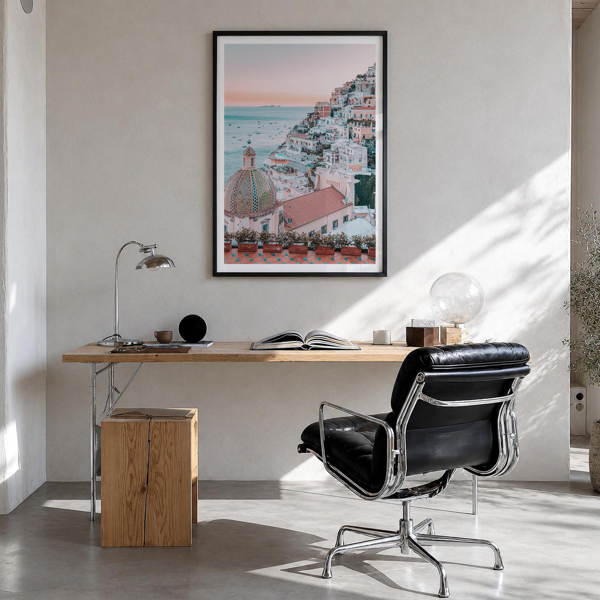 Positano no. 1 colorful photo poster of Italy – vertical wall art in black wood frame with white border, hanging on wall