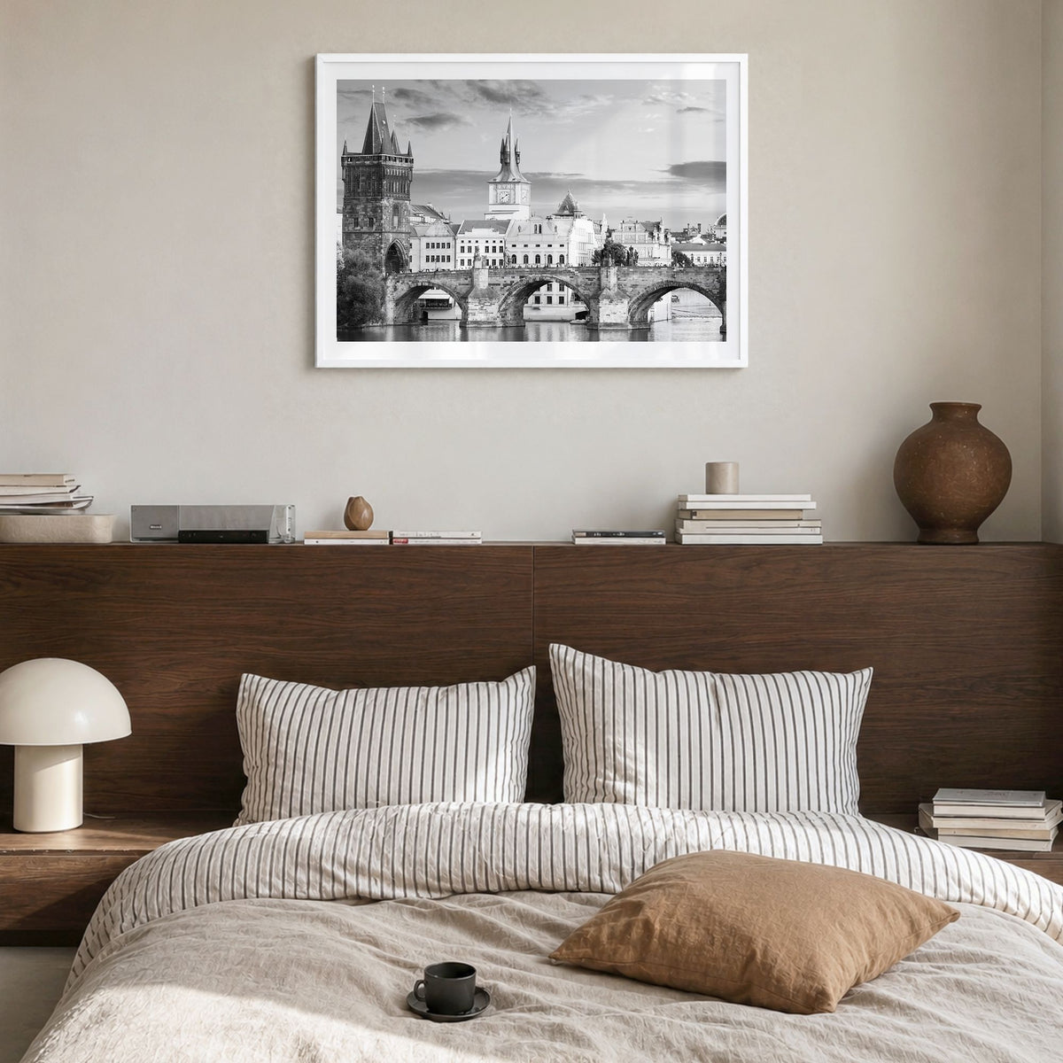 Prague Photo Poster in a white wood frame, hanging in a bedroom, white border