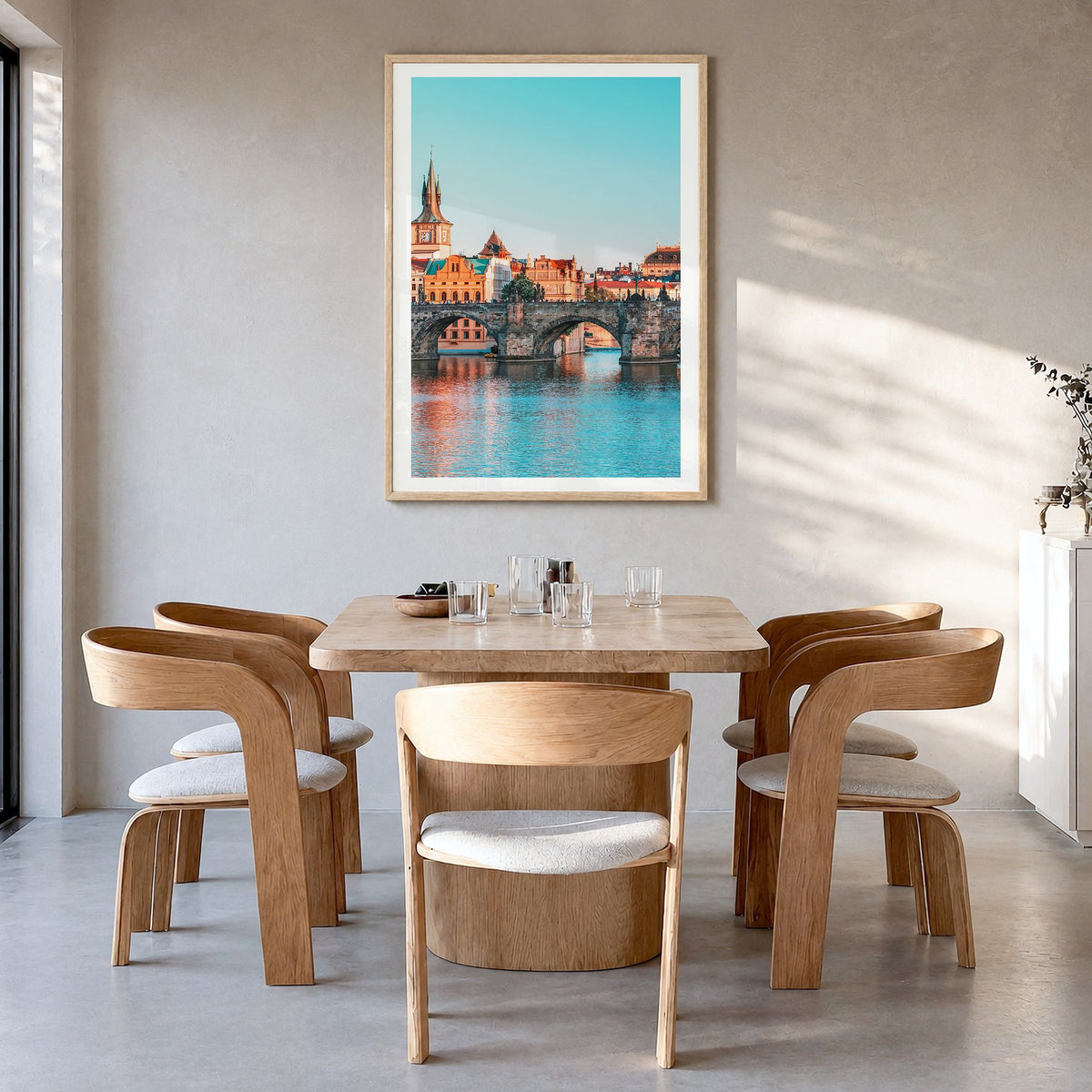 Prague Photo No 1 Poster in a natural wood frame, hanging in a dining room, white border