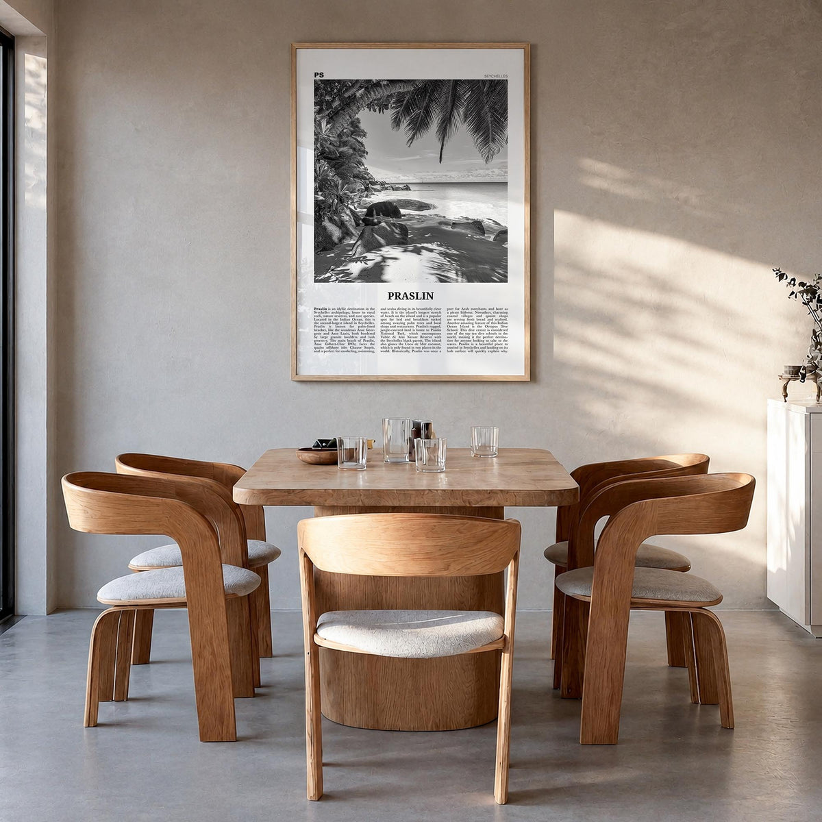 Praslin black & white newspaper poster of Seychelles – vertical wall art in natural wood frame, hanging on wall