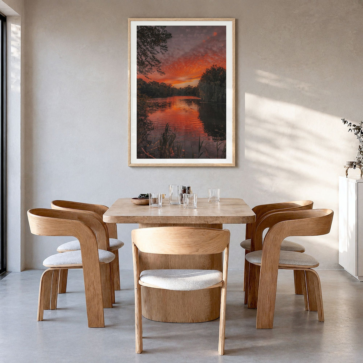 Prospect Park Lake Photo Poster in a natural wood frame, hanging in a dining room, white border